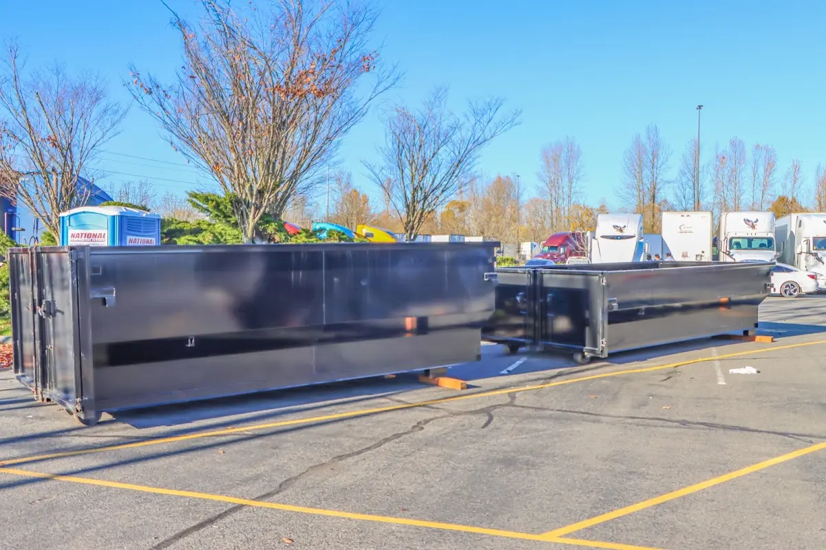 Professional dumpster rental service with roll-off container on residential driveway in Myrtle Beach